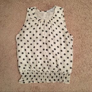 White polka dot sleeveless blouse from Collective Concepts